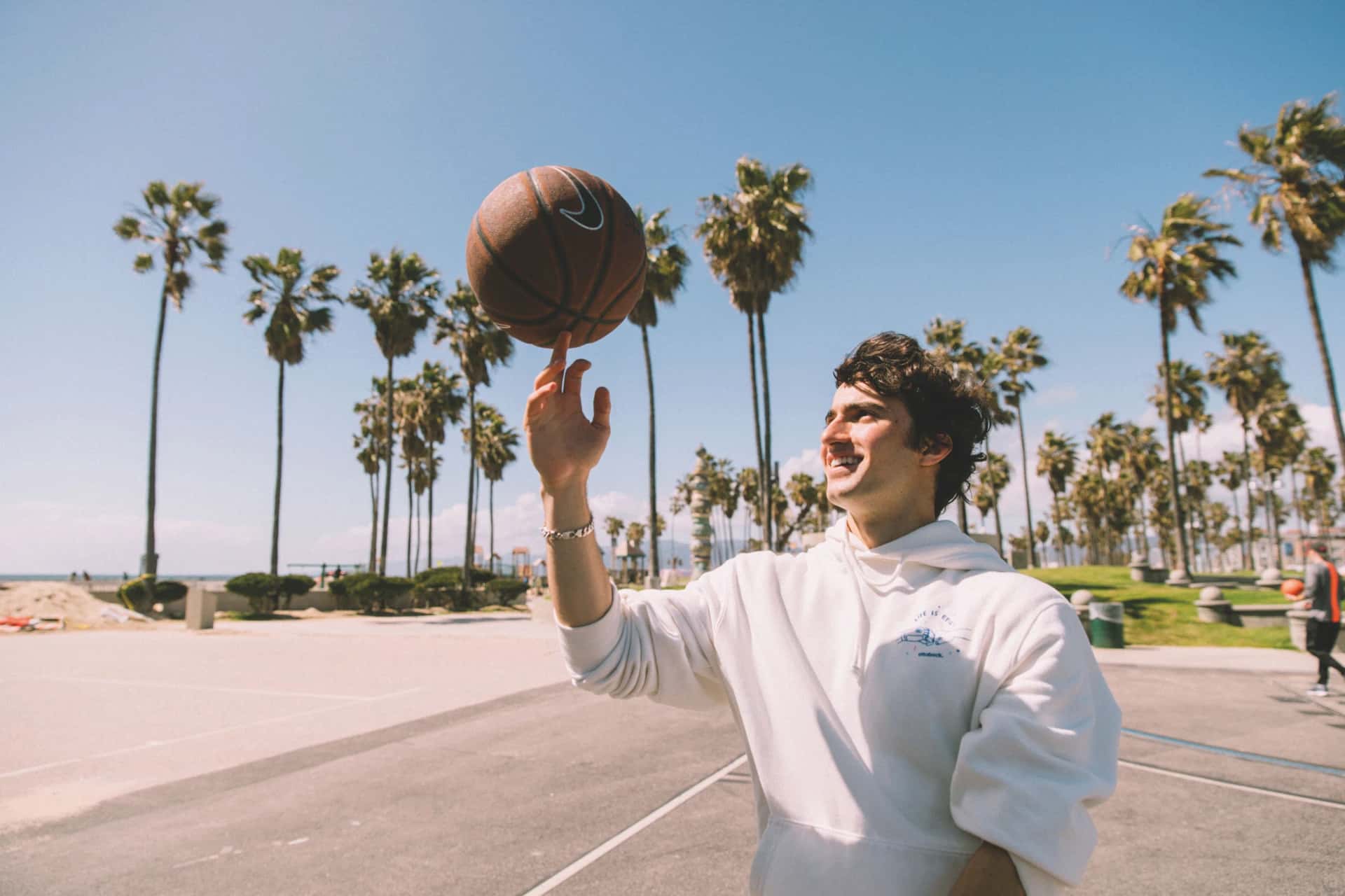 Ezra spinning a basketball on his finger